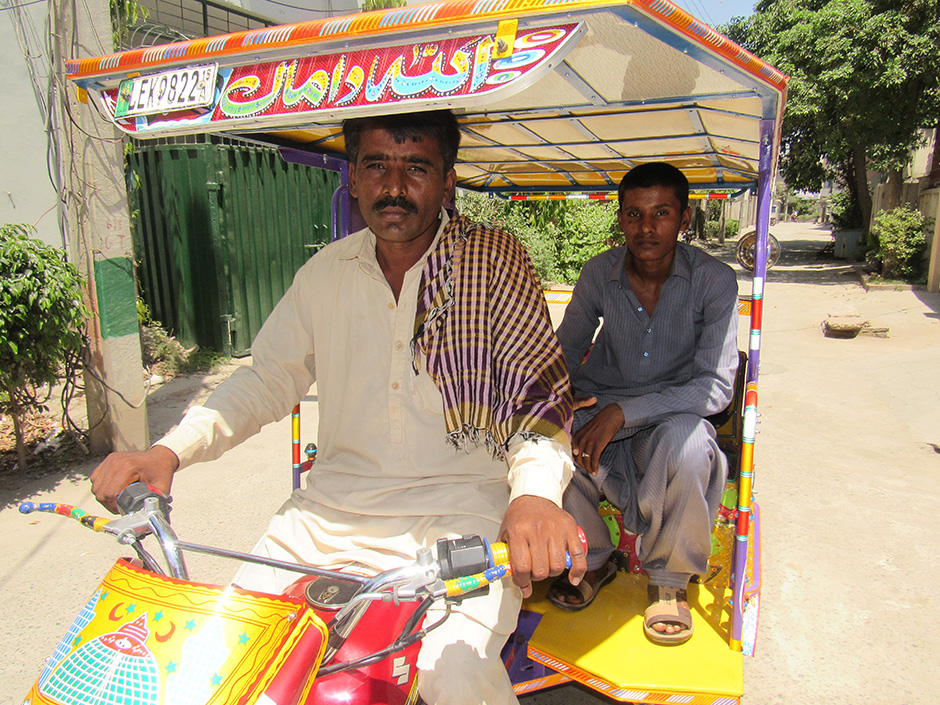 Muhammand Fiaz in the backseat.